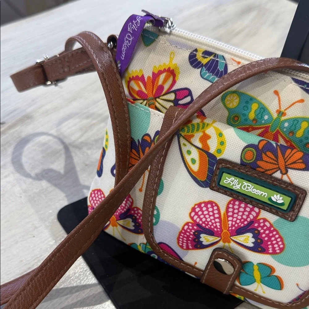 Lily Bloom Cream Crossbody Bag with Multicolor Butterfly Print and Brown Trim - Picture 3 of 12